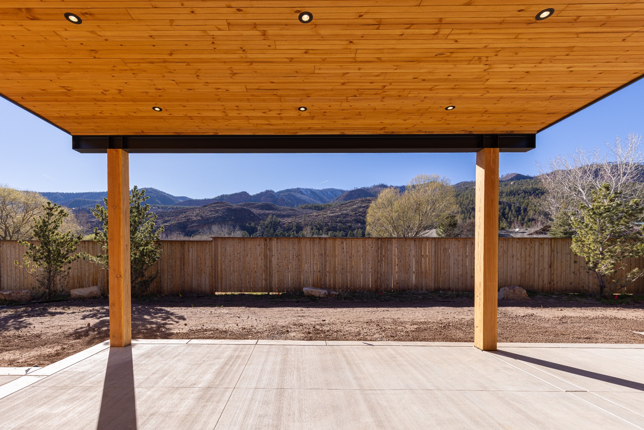 Covered porch framing views of the surrounding mountains