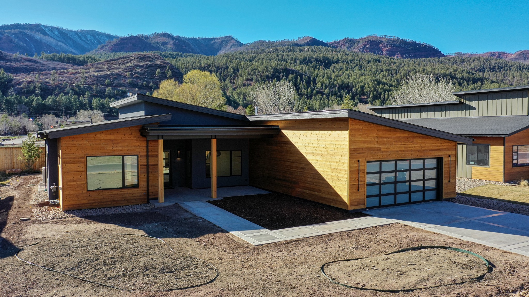Willow Custom Homes residence set below forested Colorado mountains